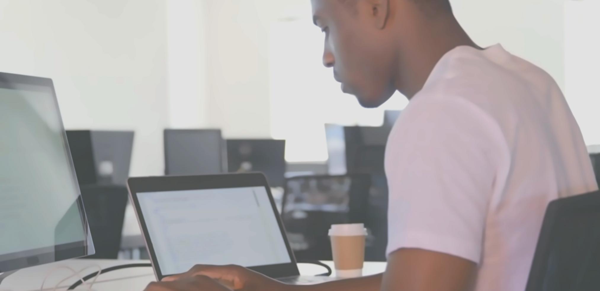 Designer working on visual layout project at desk